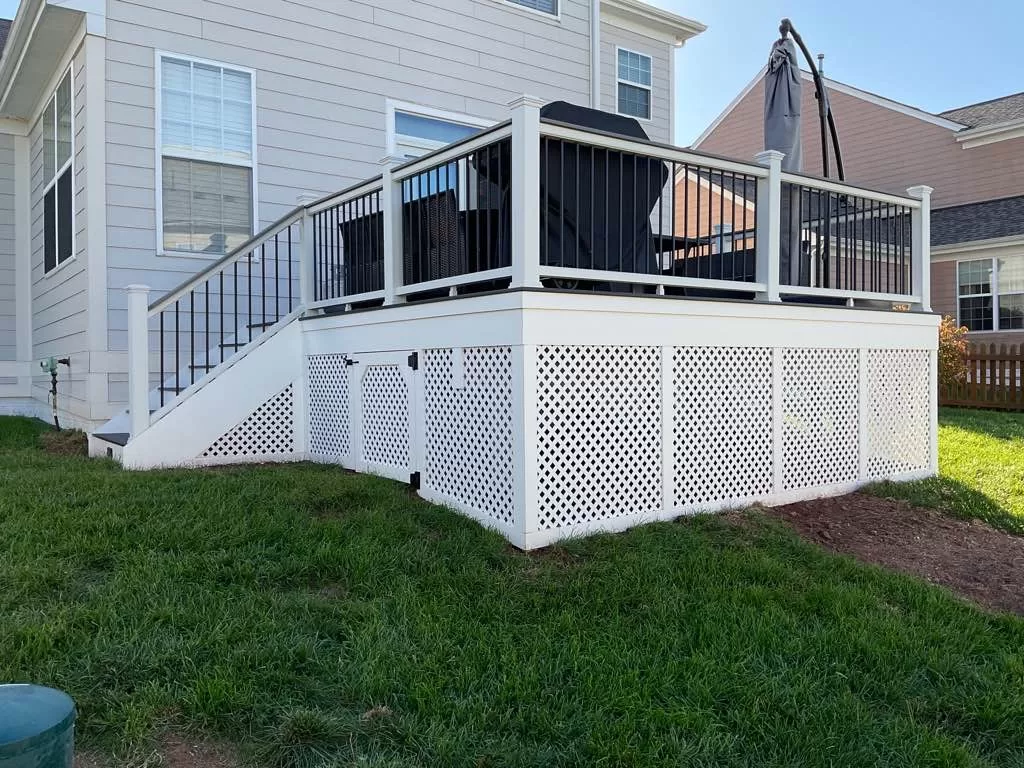 Deck installation with stairs, railing and lattice