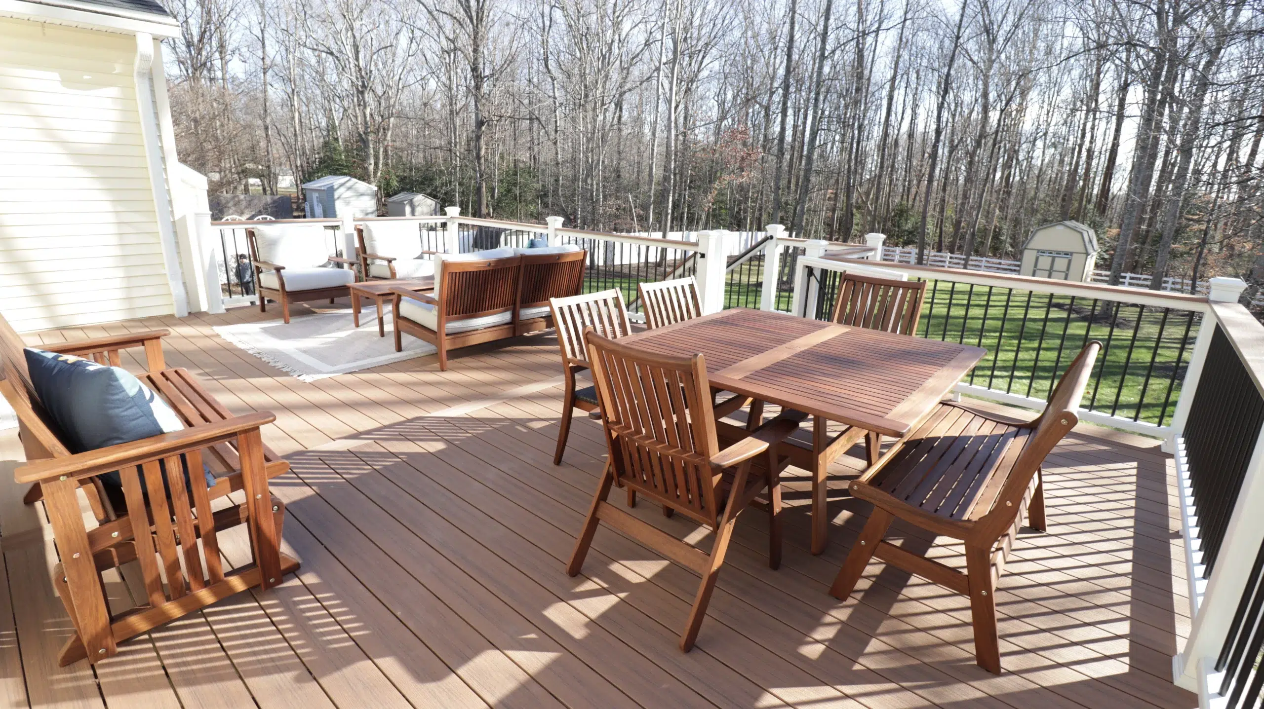 Composite deck with dinner tables and chairs