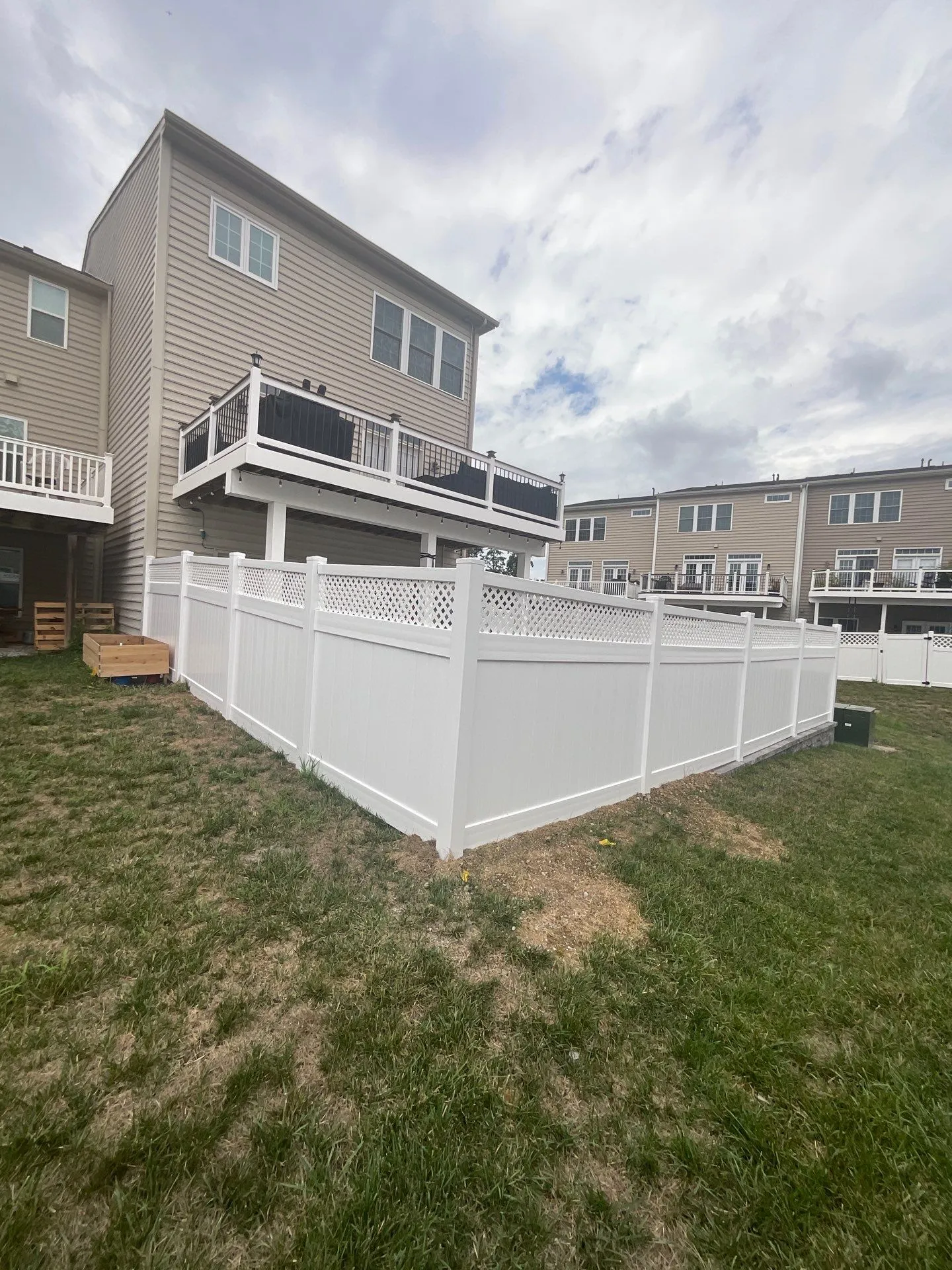 Zoomed out view of a vinyl fence