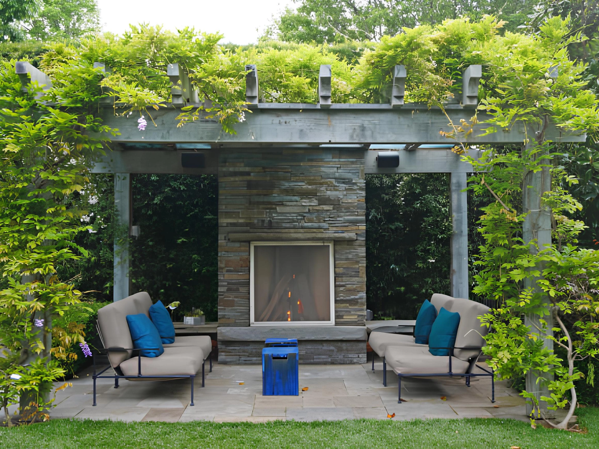covered-patio-with-a-pergola-and-a-freplace-featuring-plants-background-on-the-virginia